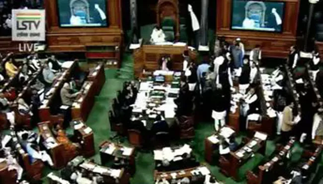 Lok Sabha adjourned for the day after ruckus over  - Sakshi