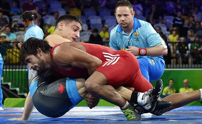 Bajrang Punia Wins Gold In Freestyle 65 Kg Wrestling - Sakshi