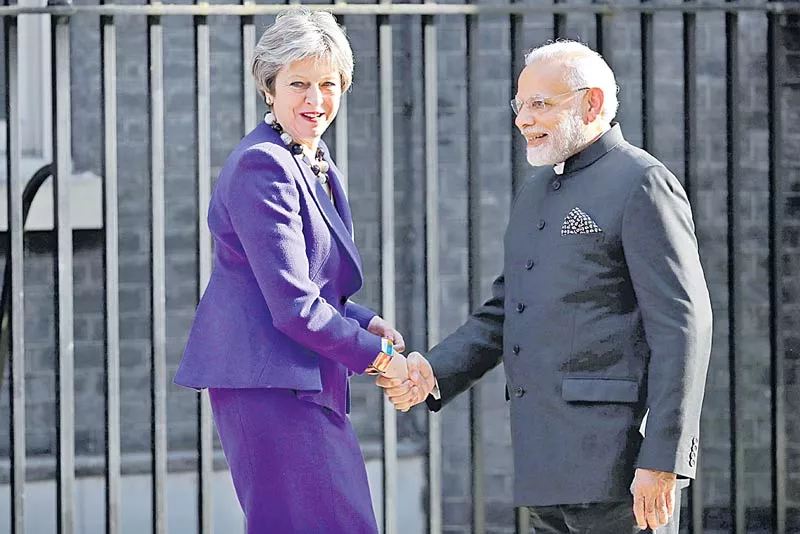 PM Modi Meets Theresa May For Bilateral Talks On Immigration, Counter-Terrorism - Sakshi