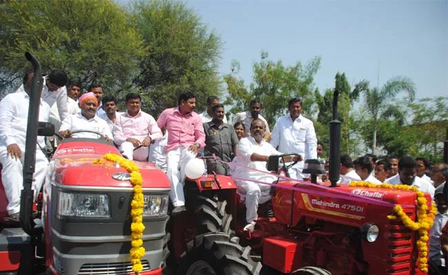 Telangana Speaker Madhusudhana Chary Distributed Subsidy Tractors At parakala - Sakshi