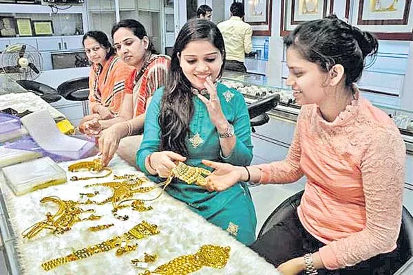 Stronger Dollar  Higher Treasury Yields Hurt Gold - Sakshi