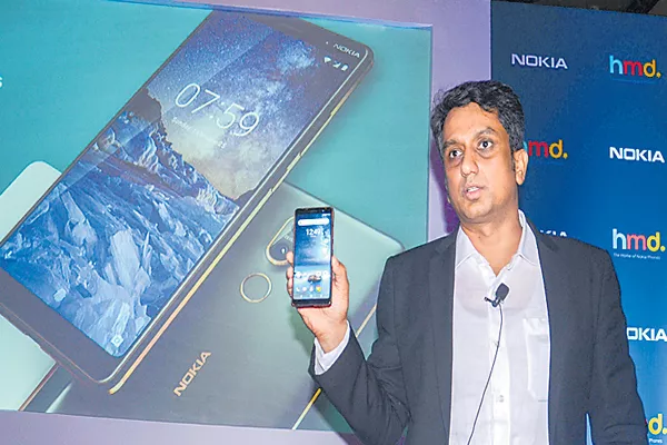 Nokia back to profit in India - Sakshi