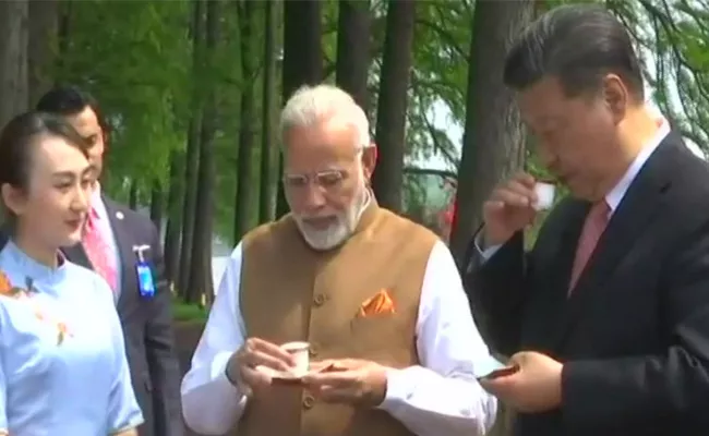 Chai Pe Charcha In China Between Narendra Modi And Xi Jinping - Sakshi