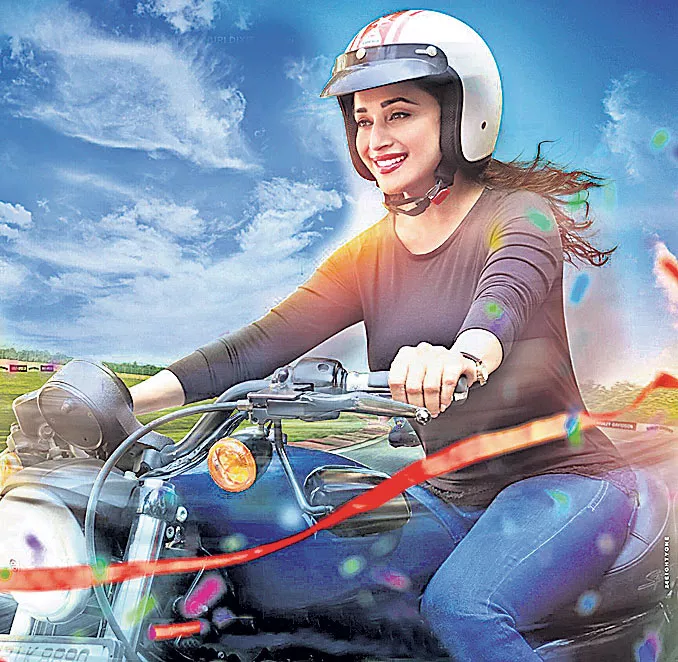 Madhuri Dixit rides bike for her debut Marathi film Bucket List  - Sakshi