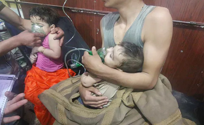 Dozens killed in suspected chemical attack in Douma town - Sakshi