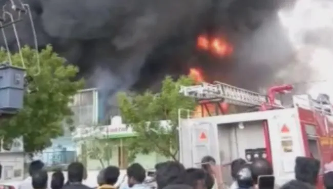 Huge Fire Accident at Auto Nagar in Vijayawada - Sakshi