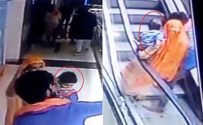 Baby Dies After Falling From Escalator In Ganganagar - Sakshi