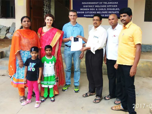 Overseas Couple Receiving The Adoption In Mahabubnagar - Sakshi