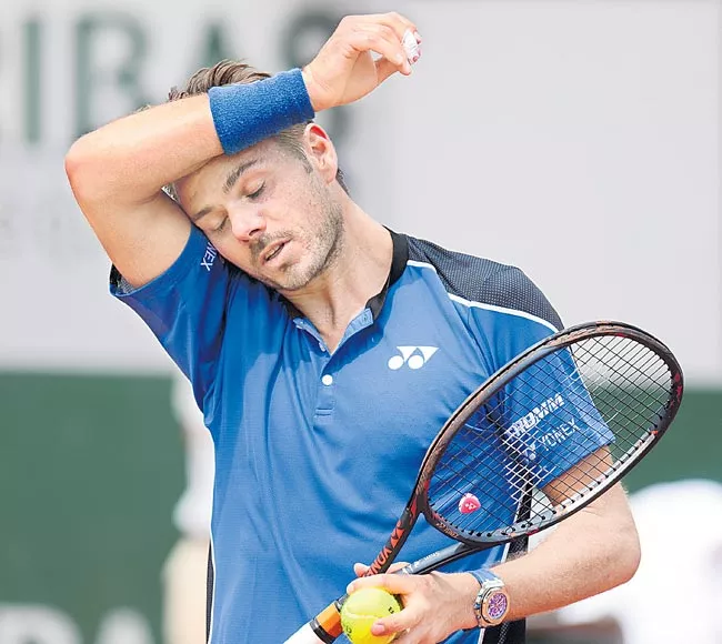 Former Champion Stan Wawrinka Knocked Out In 1st Round - Sakshi