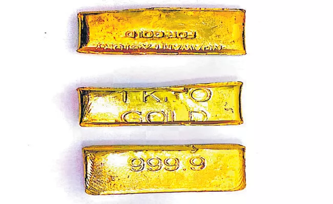 Gold Biscuits Seized In Shamshabad Airport - Sakshi