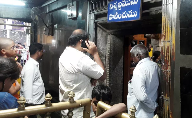 TDP Leader Cell Phone Use In Kanipakam Temple Chittoor - Sakshi