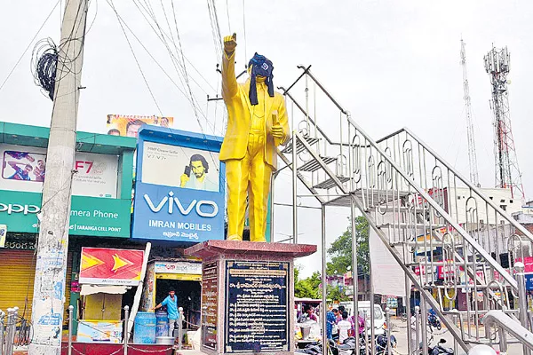 Black mask to ambedkar statue - Sakshi