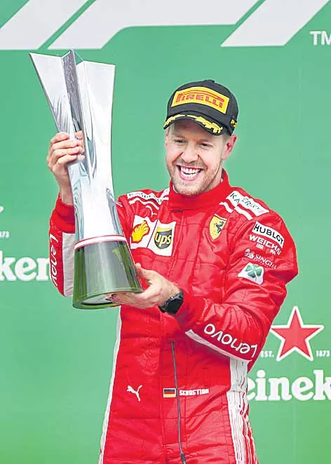 Vettel takes 50th win and F1 championship lead in Canada - Sakshi