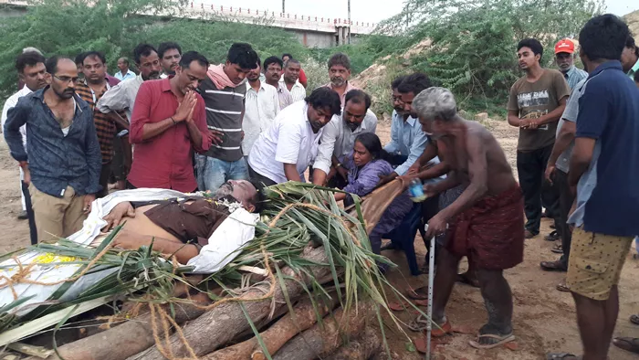 Mother Did Funerals To Her Son In YSR Dist - Sakshi