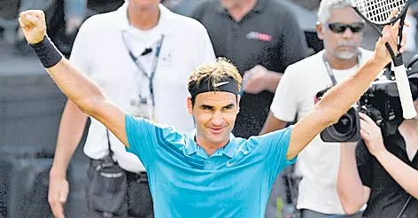 Roger Federer reacts to snatching world No 1  - Sakshi