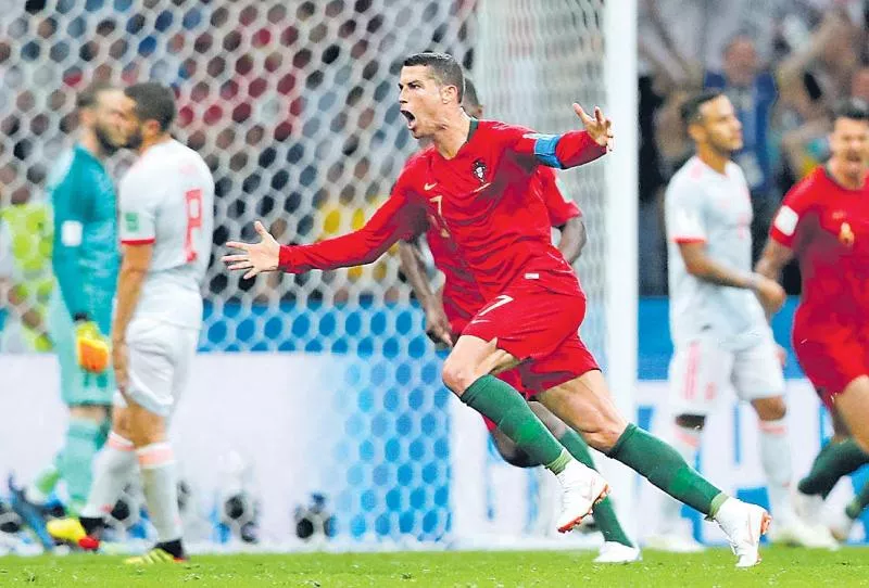 Portugal draws Spain on Ronaldo hat trick - Sakshi