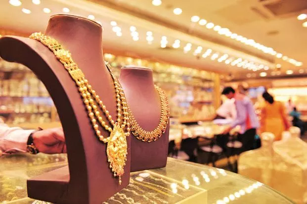 Gold slumps by Rs 300 on weak global cues, low demand         - Sakshi