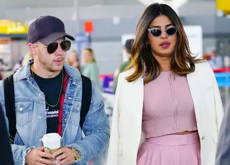 Priyanka Chopra arrives with beau Nick Jonas in Mumbai - Sakshi