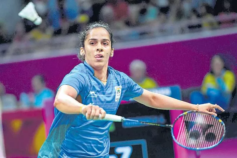 Saina Nehwal sails into second round of Malaysian Open badminton - Sakshi