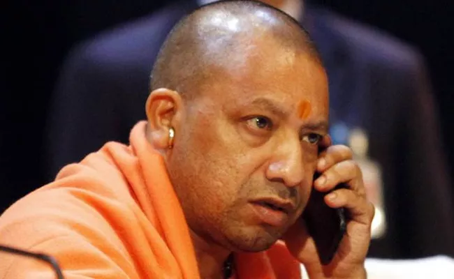 CM Yogi Adityanath Speaks To Solves Ramdev To Food Park Issue - Sakshi