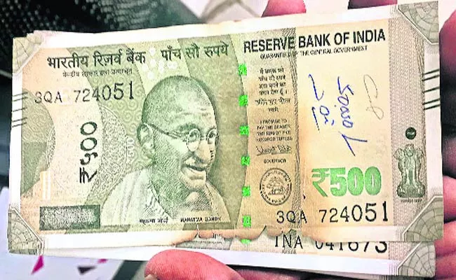 Burn Rs. 500 note in ATM - Sakshi