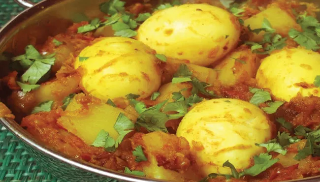 Woman shot dead for not cooking egg curry for her husband in UP - Sakshi