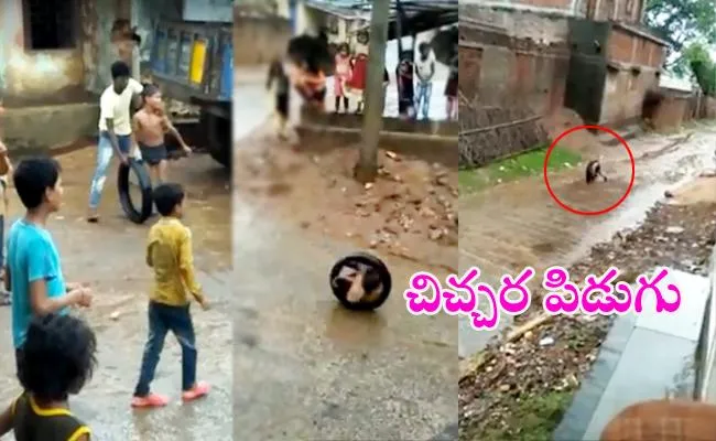 Boy Rolls Around The Street In A Tyre video goes viral in Social Media - Sakshi