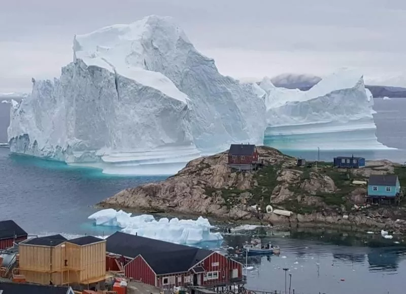 Huge iceberg threatens tiny Greenland village - Sakshi