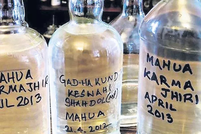 Govt mulls selling 'mahua' in bottles - Sakshi