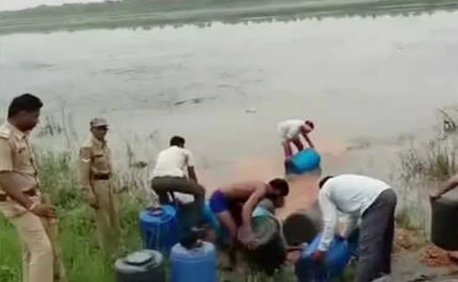 Madhya Pradesh Excise Man Poor Liquor Into Narmada River - Sakshi