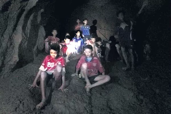 Thai authorities deciding how to rescue soccer team from flooded cave - Sakshi