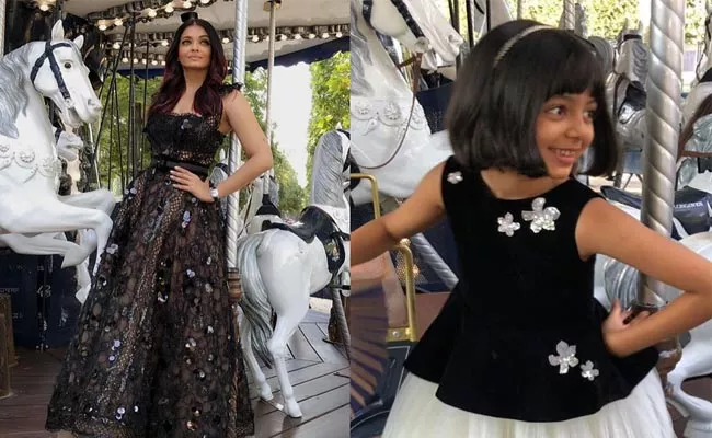 Aishwarya Rai Daughter Aaradhya Pose In Gorgeous Dresses On Paris - Sakshi