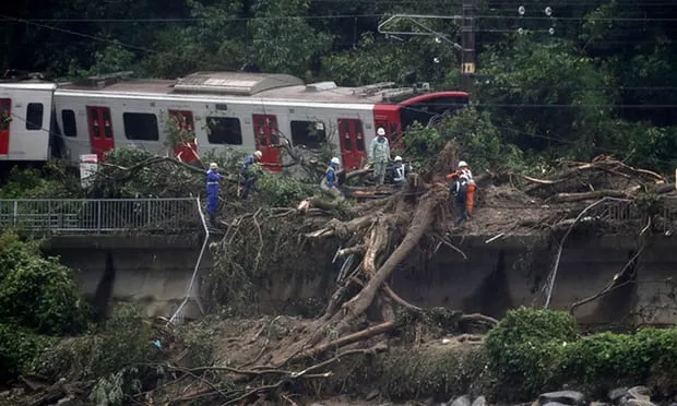 Flash Floods Landslides And Earth Quake Hits Japan - Sakshi