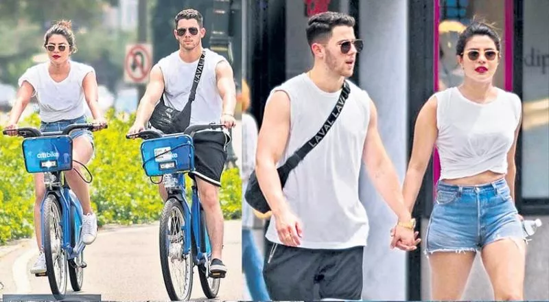 Priyanka Chopra and Nick Jonas enjoy cycling on New York streets - Sakshi