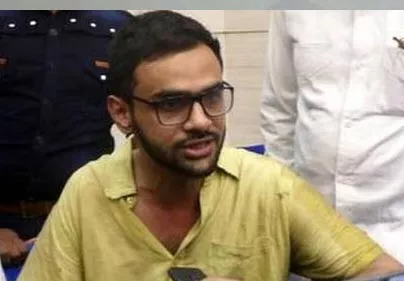 Umar Khalid escapes unhurt after being shot at - Sakshi