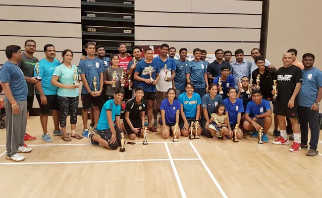 Singapore Telugu Samajam conducts Badminton Tournament - Sakshi