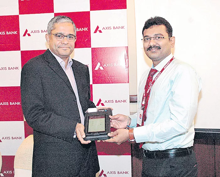 India Axis bank launches iris authentication - Sakshi