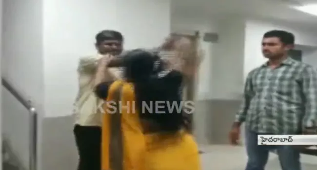 Woman Slaps Man With Slipper In Police Station - Sakshi