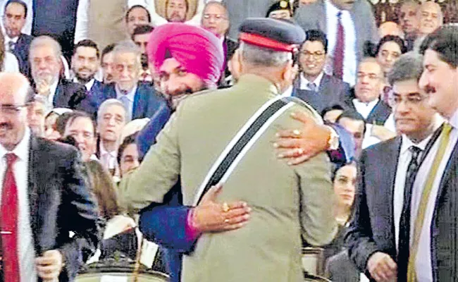 Navjot Singh Sidhu Hug To Pakistan Army Chief Trolled - Sakshi