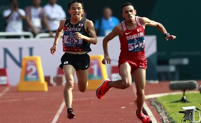 Asian Games Marathon Winner Hiroto Accused of Pushing Rival Elabbassi During race - Sakshi