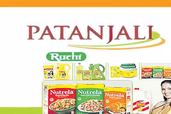 Patanjali objects to lenders decision to award Ruchi Soya to Adani Wilmar - Sakshi