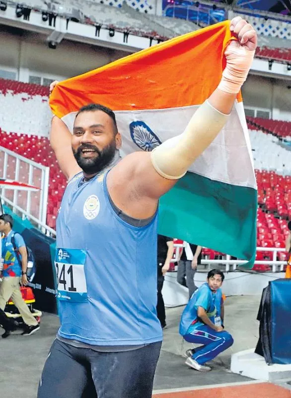 Indian Shot Put Player Tejinder Pal Singh Toor Wins Gold At Asiad 2018 - Sakshi