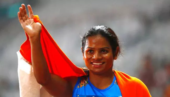 Silver medallist Dutee Chand awarded Rs 1.5 crore by Odisha government - Sakshi