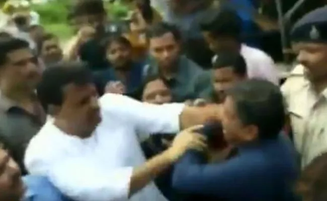 Congress MLA Umang Singhar Slaps BJP Leader In Madhya Pradesh - Sakshi