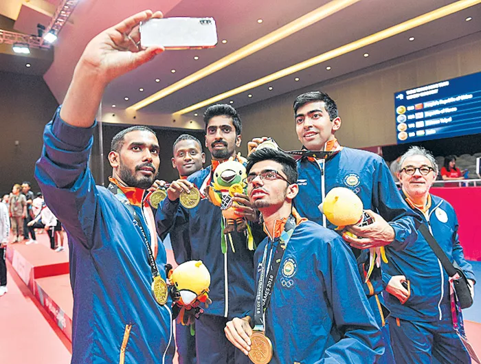  Indian men table tennis team wins historic bronze - Sakshi