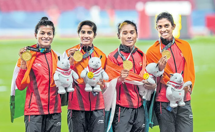 Asian Games 2018: Hima Das Leads The Pack As India Clinch Gold In Women's 4x400m Relay - Sakshi