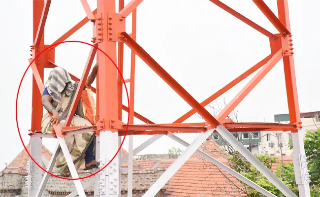 Woman Climb Cell Tower For Justice In Visakhapatnam - Sakshi