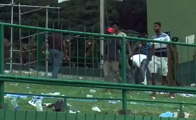 Sri Lankan Fans Cleaned The Pallekele Stadium  - Sakshi