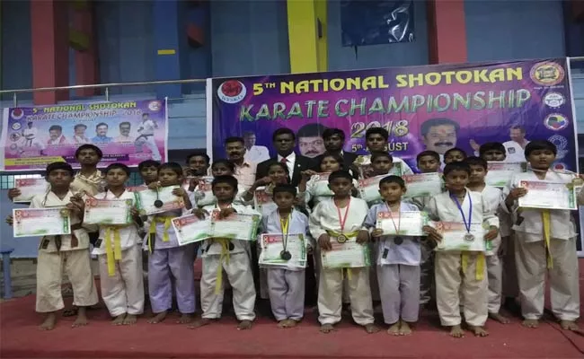 Medals To Universal School Students In Karate - Sakshi