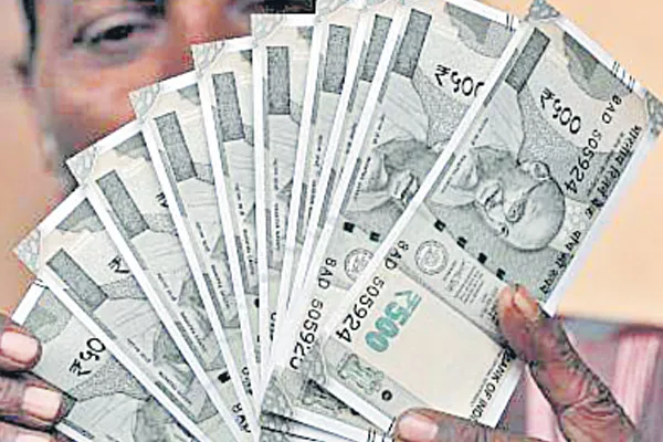 Rupee slides further, hits fresh low of 71 - Sakshi